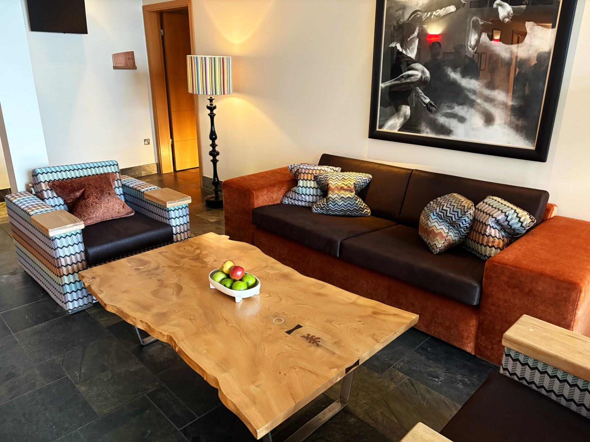 Warm-toned waiting room with armchairs and a coffee table